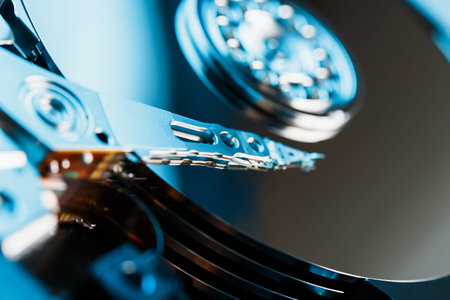 Disassembled hard drive from the computer, hdd with mirror effect. Opened hard drive from the...