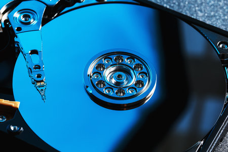 Disassembled hard drive from the computer, hdd with mirror effect. Opened hard drive from the...