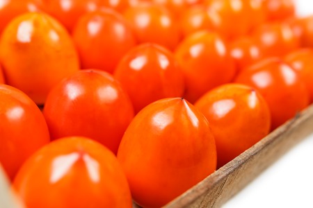 Fresh ripe persimmons in market. Persimmons background.の写真素材