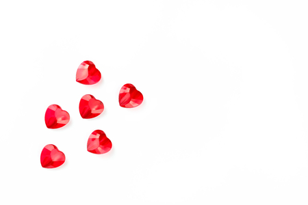Heart shaped crystals on a white textured surface. Mood of tenderness and love. Valentine's Day Symbols. Five little heartsの写真素材