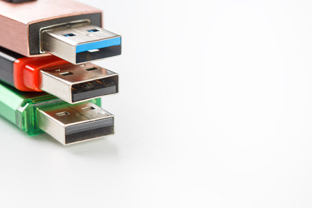 Detailed view of a black USB flash drive with a silver-blue connector. Photo on a white background with space for your text.の写真素材