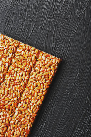 Useful snacks. Fitness diet food. Boletchik from kozinaki sunflower seeds, energy bars. Black...