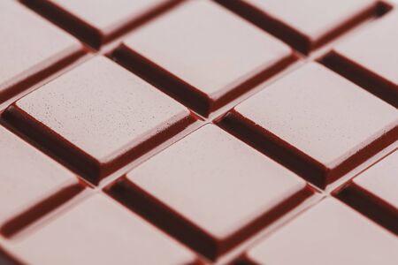 Texture of milk chocolate close up. Segments of chocolate in the macro. Full frame texture. macroの写真素材
