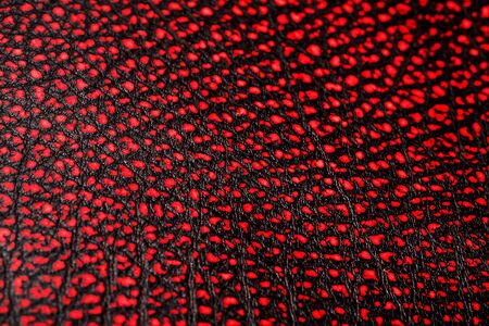 Red - black textured reptile skin, used texture for the background. Lizard or crocodile skin. Freshwater crocodile red bone skin texture background. .Full screen, top viewの写真素材