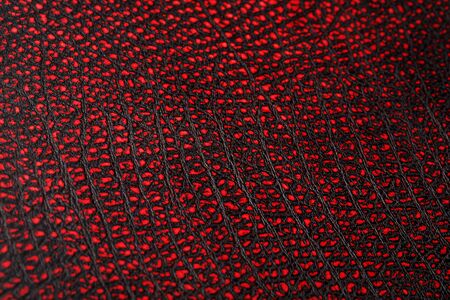 Red - black textured reptile skin, used texture for the background. Lizard or crocodile skin. Freshwater crocodile red bone skin texture background. .Full screen, top viewの写真素材