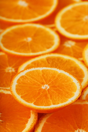 Round orange slices, in the form of texture and lanterns of fresh juicy slices. Fullscreen flat...