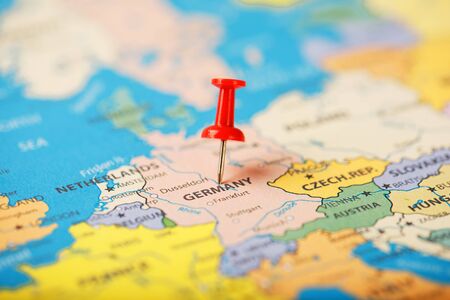 The location of the destination on the map of Germany is indicated by a red pushpin. Germany is marked on the map with a red buttonの写真素材