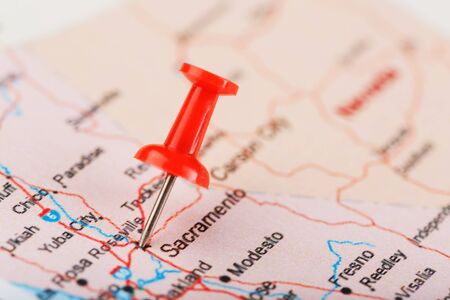 Red clerical needle on a map of USA, California and Sacramento Capital. Close up map of California with red tack, US map pinの写真素材
