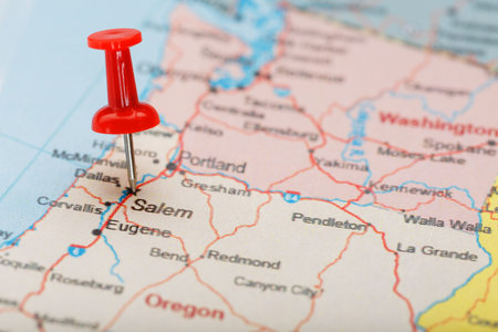 Red clerical needle on a map of USA, Oregon and the capital Salem. Closeup Map Oregon with Red Tack,...