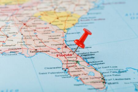 Red clerical needle on a map of USA, South Florida and the capital Tallahassee. Close up map of South Florida with red tack, United States map pin USAの写真素材