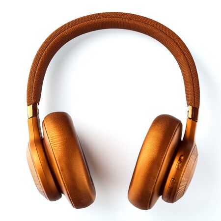 Wireless golden headphones on a white background. View from above. In-ear headphones for playing games and listening to music tracks. Modern conceptual, glamorous style.の写真素材