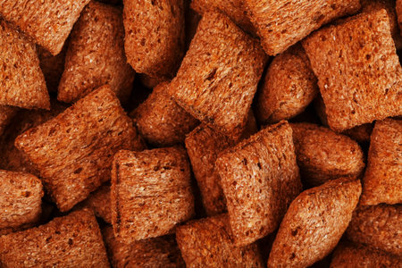 Chocolate pads, sweet breakfast cereal with chocolate filling. Full screen, top view close-up.