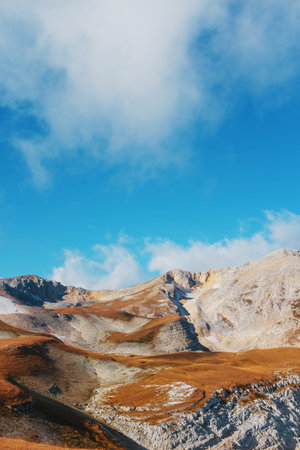 Route through mountain peaks and hills through majestic landscapes. Active tourists, hiking,...