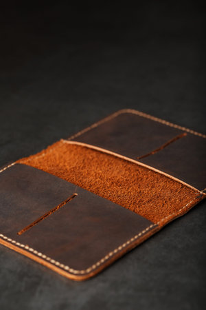 Open Dark Brown Leather Passport Cover. Genuine leather, handmade. Close up stitching, View from...