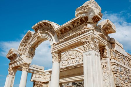 Ruins of the ancient urban architecture of the city of Ephesus, against the blue sky Temple of Hadrian. Turkeyの写真素材