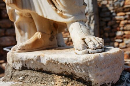 Elements of marble legs of an ancient statue of the ruined city of Ephesus in Turkey. Elements of Ancient Antiquityの写真素材