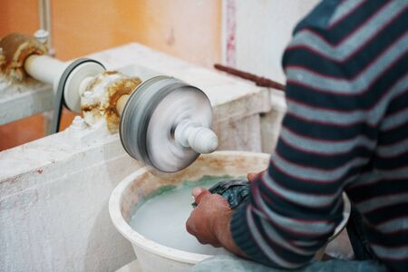 The master makes a souvenir from onyx on the machine. Manual labor. Turkeyの写真素材