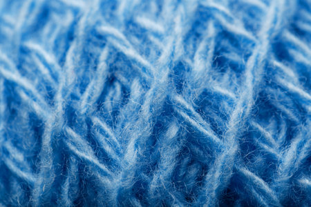 Wool yarn close-up colorful blue threads for needlework in macro. Background texture fabric for...