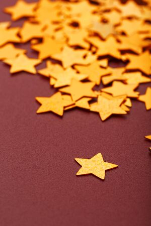 Gold stars on red background. The concept of greeting cards, headlines and web site.の写真素材