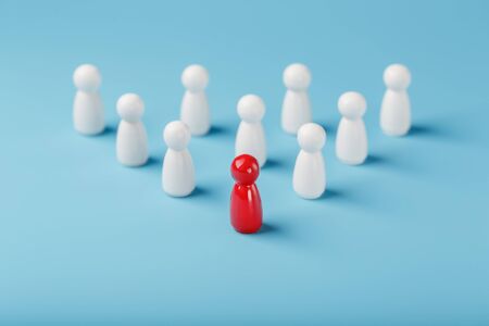 The leader in red leads a group of white employees to victory, HR, Staff recruitment. The concept of leadership. A lot of employees are reaching for their boss. Personnel selection.の写真素材