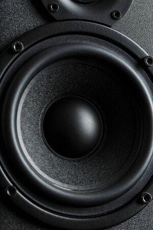 Multimedia speaker system speaker close-up on a black background. A detailed snapshot of some of the old round speakers. Powerful and clear soundの写真素材