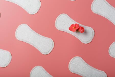 women intimate hygiene products - sanitary pads and tampon on pink background. Feminine hygiene pad. hygiene during menstruation. women critical days, gynecological menstruation cycleの写真素材