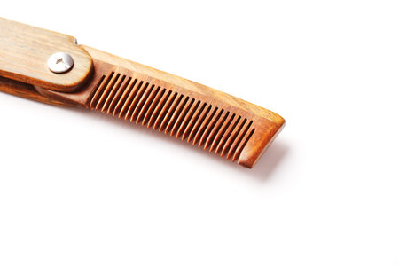 Wooden comb made of natural sandalwood for men on a white background. Care for men's hair and beard. Isolate. Barbershopの写真素材