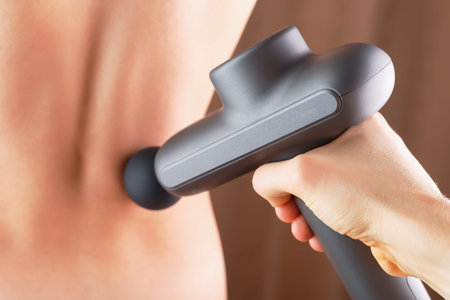 Back massage with an Electric body massager.