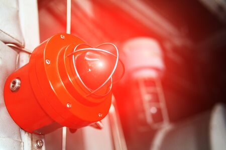 Fire alarm with red warning light of an emergency beacon at an industrial facility. Danger signalの写真素材