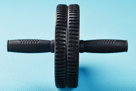Sports roll for training muscles and abs on the blue Mat. Sports at home