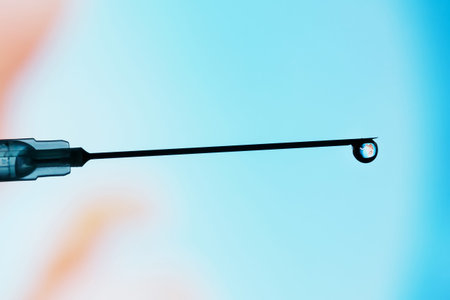 A human embryo on the tip of a needle. Artificial insemination. Test tube baby, IVF