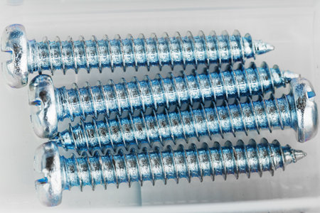 Steel self-tapping screws used for construction and installation. Close-up, macro