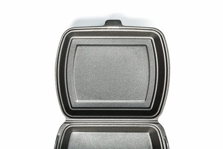 Opened Lunch Box disposable, black for food delivery service on a white background. Isolate, free...