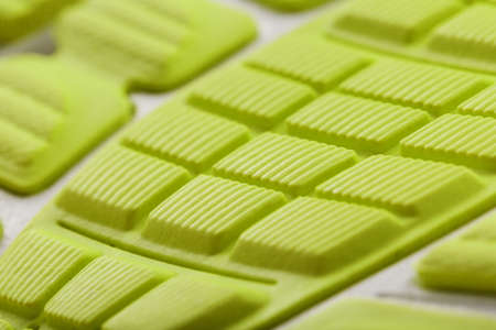 Close-up of the tread of a yellow sneaker, the textured pattern of the sole. Macroの写真素材
