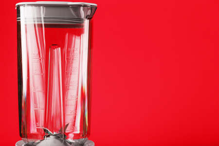 Blender with cup on red background with free space. Minimalistic conceptの写真素材