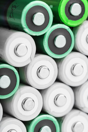 AA batteries as a texture background in full screen. The concept of energy supply and rational...