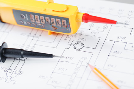 Yellow voltage indicator in close-up on the electrical diagram. Testing and verification of power gridsの写真素材