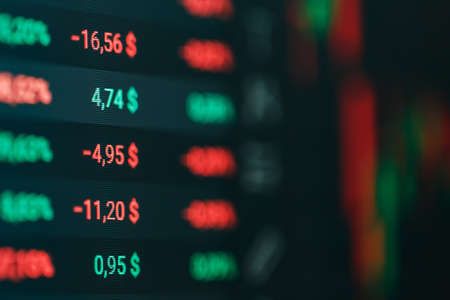 Close-up of Forex stock market price chart and tickers on digital screenの写真素材