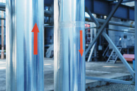 Red arrows of the direction of the medium on the pipeline. Fuel and gas supplyの写真素材