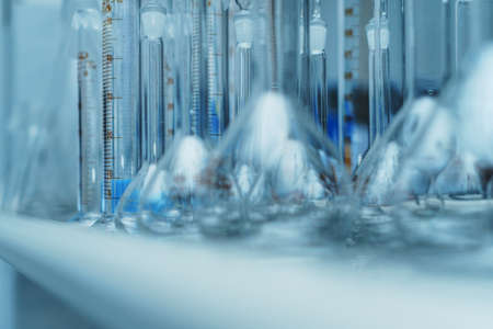 Laboratory glass flasks and test tubes on a rack. Research conceptの写真素材