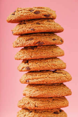Oatmeal cookies stacked on a pink background. Free spaceの写真素材