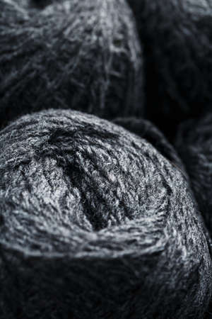 Tangles of gray yarn made of natural wool close-up in full screen.の写真素材