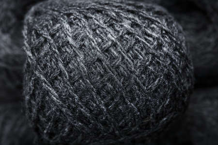 Tangles of gray yarn made of natural wool close-up in full screen.の写真素材