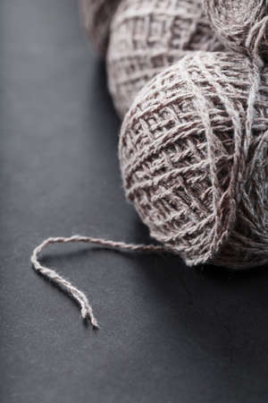 Light brown wool yarn made of threads in tangles. Needleworkの写真素材