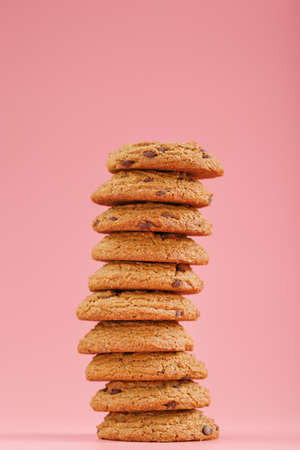Oatmeal cookies stacked on a pink background. Free spaceの写真素材
