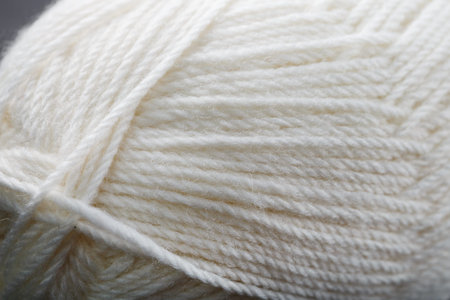 White threads of natural wool close-up in full screen. Macro