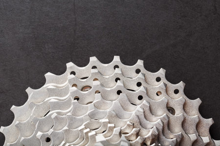 Bicycle stars from a bicycle chain drive mechanism on a black backgroundの写真素材