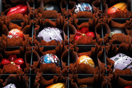Sweet handmade chocolates in a box. The art of chocolate