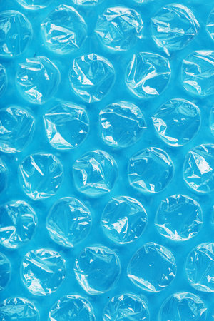 Packing plastic wrap for parcels on a blue background in full screen