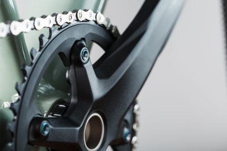 Bicycle crank system with chain close-up, mechanism for repair and tuning